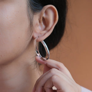 Flat silver hoop earrings