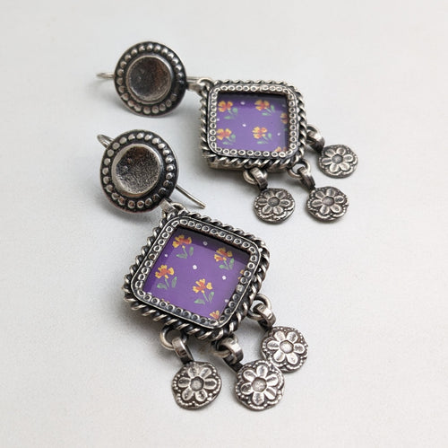 Silver earrings with purple glass