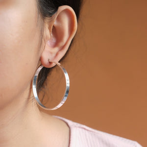Flat and round hoop earrings