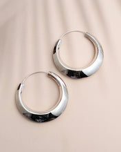 Silver hoop earrings with a slant