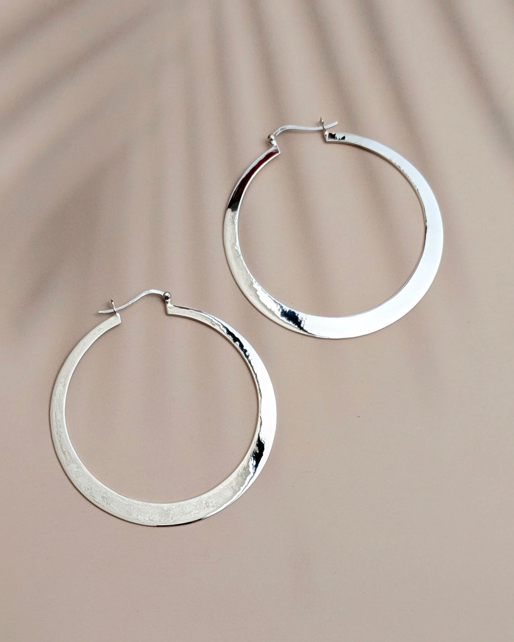 Flat silver hoop earrings