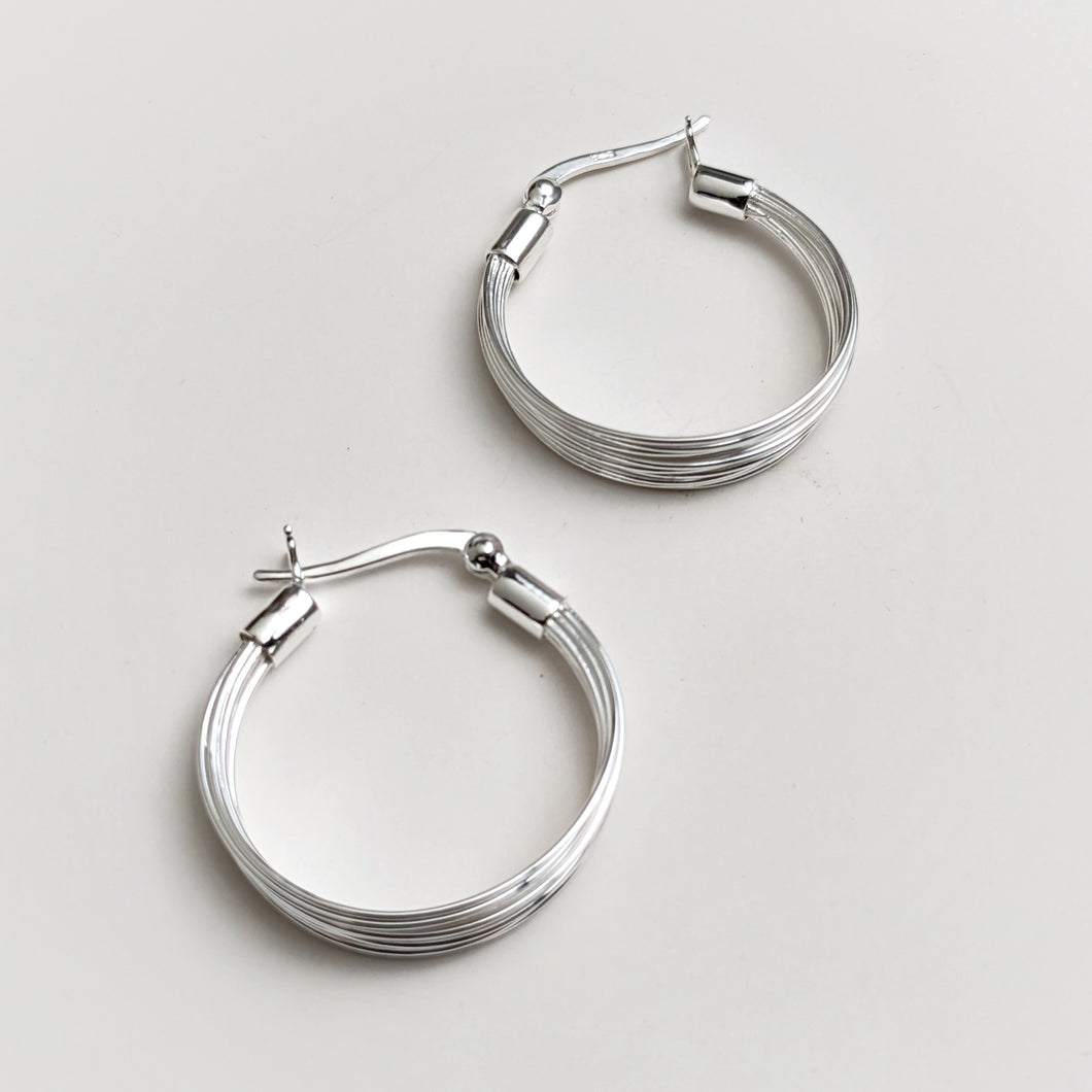 Multi line silver hoops