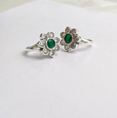 Silver toe ring with green and clear cz