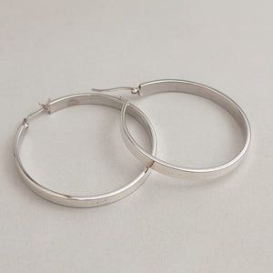 Flat and round hoop earrings