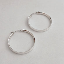 Flat silver hoop earrings