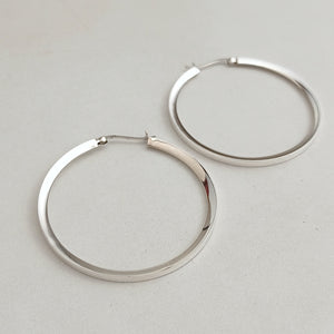 Flat inward slant silver hoop earrings