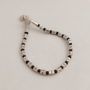 Black thread silver bead bracelet