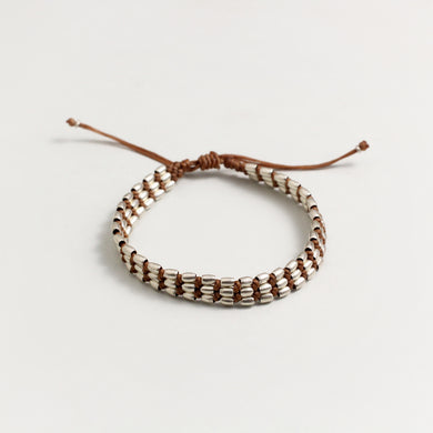 SILVER BEAD BRACELET IN TAN COLOUR THREAD