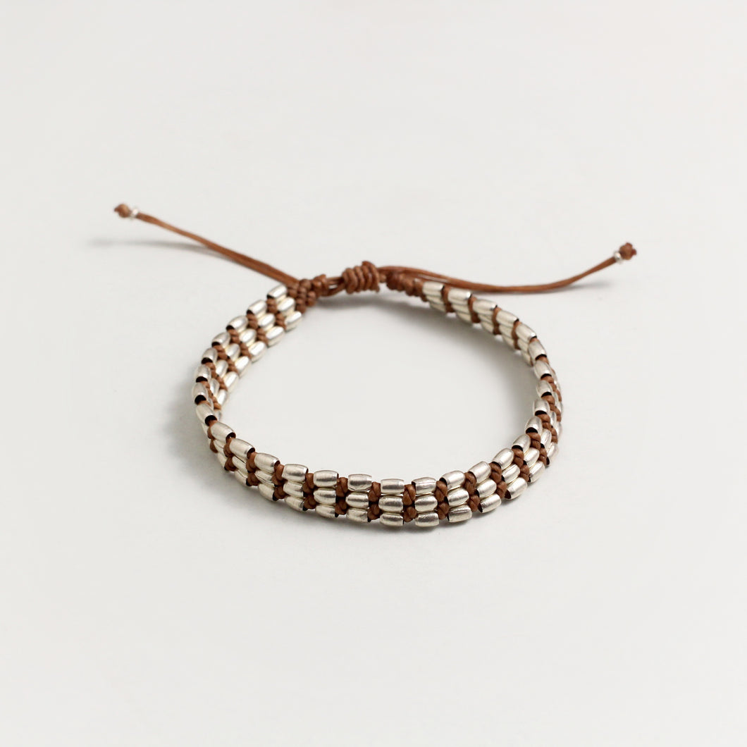 SILVER BEAD BRACELET IN TAN COLOUR THREAD