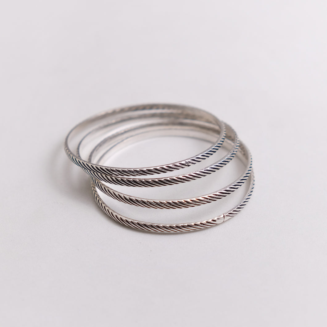BRAIDED SILVER BANGLES