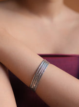 BRAIDED SILVER BANGLES
