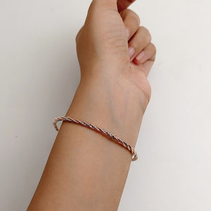 BRAIDED ROSE GOLD AND SILVER BRACELET