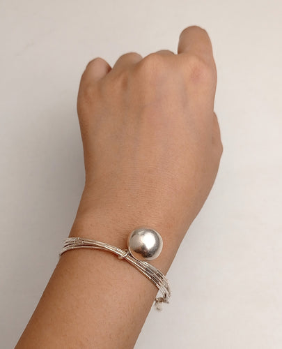 Silver bracelet with movable ball