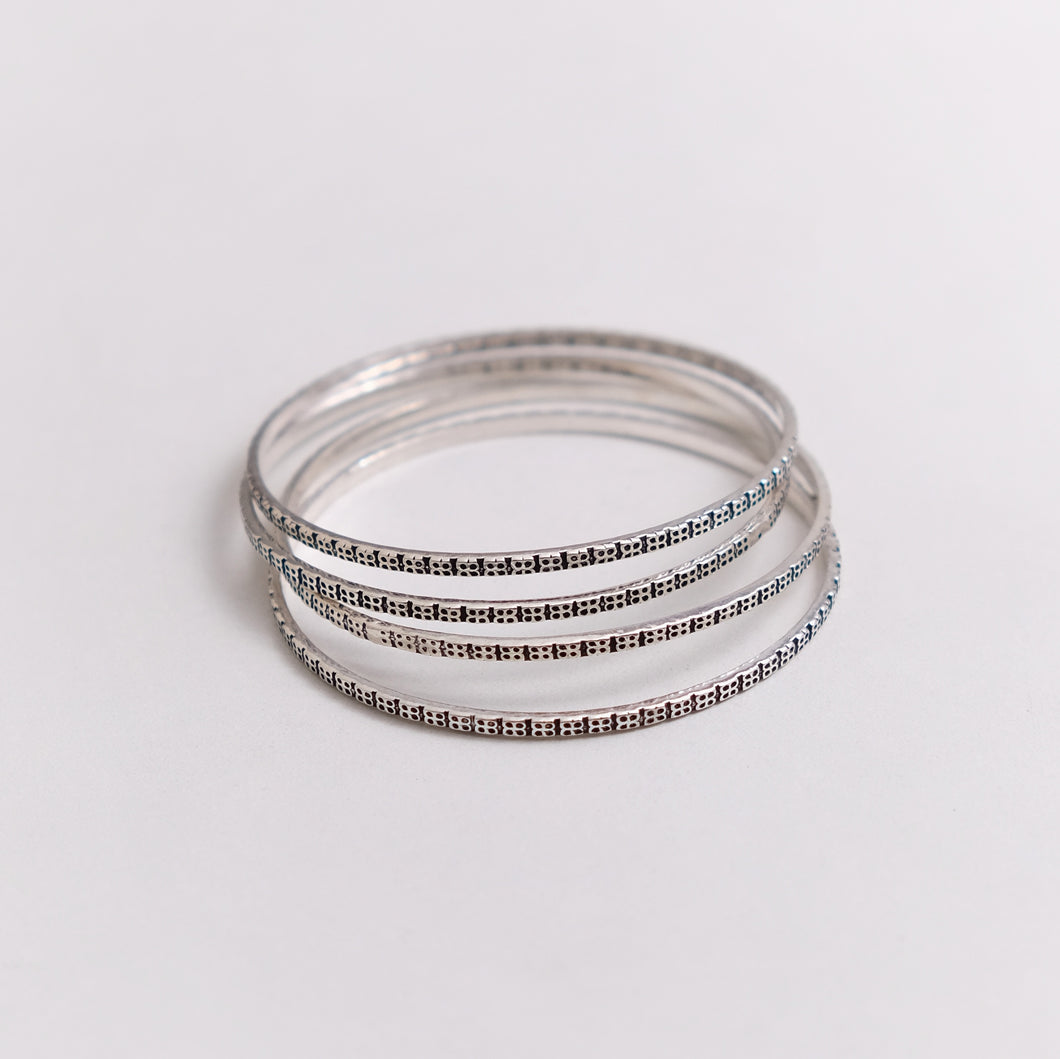 SILVER BANGLE WITH GEOMETRIC DESIGN